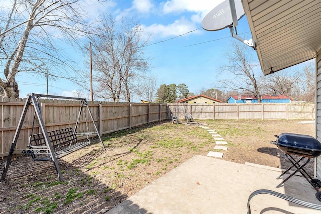 view of yard featuring a patio area and a fenced backyard