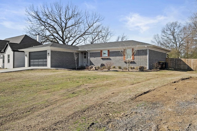 ranch-style house with a garage, brick siding, fence, and a front yard