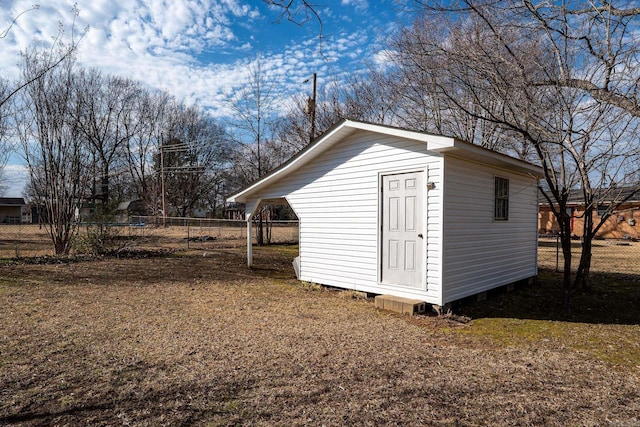 view of shed with fence