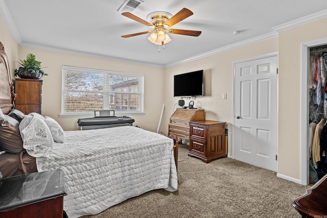 bedroom featuring a ceiling fan, baseboards, visible vents, carpet, and crown molding