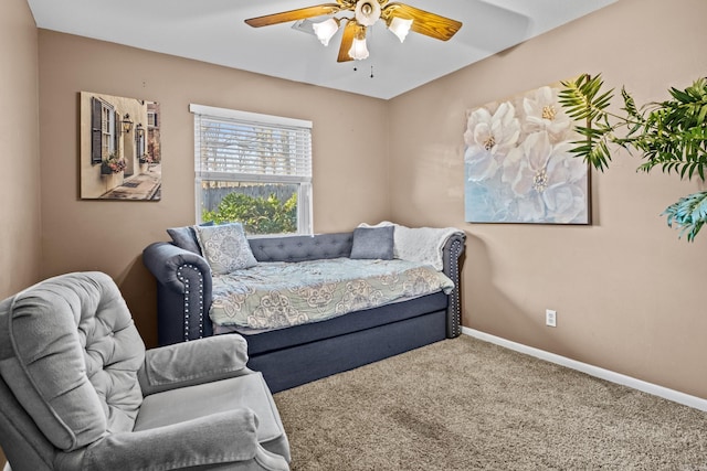 carpeted bedroom featuring a ceiling fan and baseboards