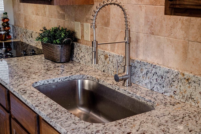 101 Long Island Dr Unit 202, Hot Springs National Park, AR 71913 - room details featuring light stone counters, backsplash, and a sink