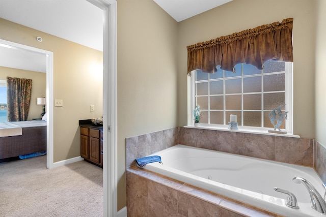 101 Long Island Dr Unit 202, Hot Springs National Park, AR 71913 - full bathroom with baseboards, plenty of natural light, a jetted tub, and ensuite bath