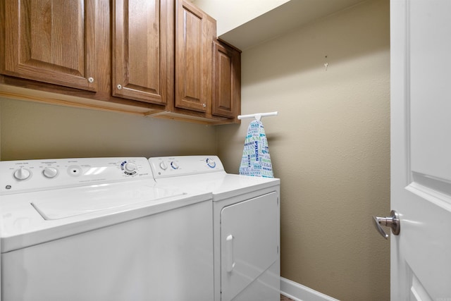101 Long Island Dr Unit 202, Hot Springs National Park, AR 71913 - laundry area featuring cabinet space, baseboards, and washing machine and clothes dryer