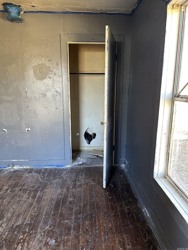 unfurnished bedroom with wood-type flooring