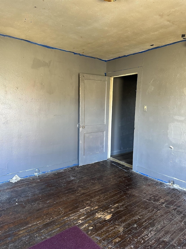 spare room featuring hardwood / wood-style flooring