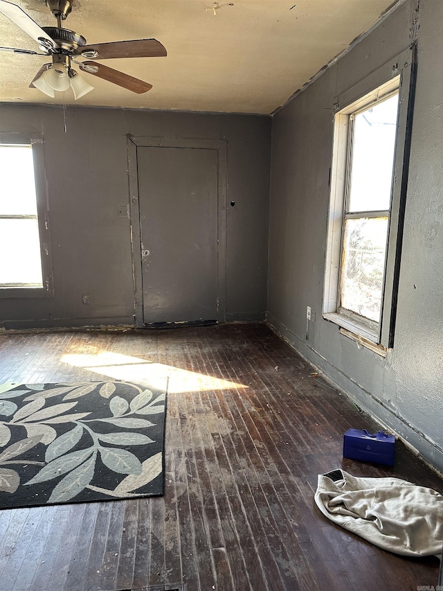 spare room with a ceiling fan and hardwood / wood-style floors