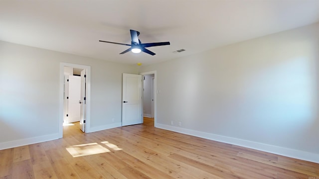 unfurnished bedroom with light wood-style floors, baseboards, visible vents, and a ceiling fan