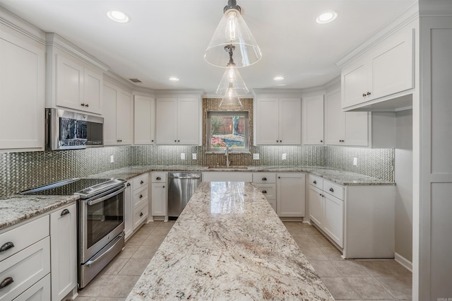 kitchen featuring appliances with stainless steel finishes, a sink, and white cabinets