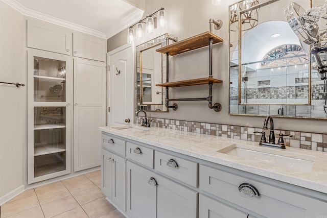 full bath with ornamental molding, tile patterned flooring, a sink, and double vanity