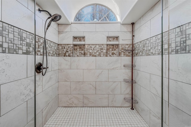 full bath with tiled shower