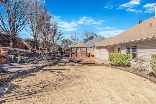 view of yard with a patio, a gazebo, and fence