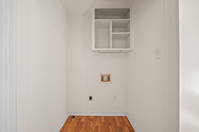 washroom featuring hookup for a washing machine, laundry area, wood finished floors, baseboards, and electric dryer hookup