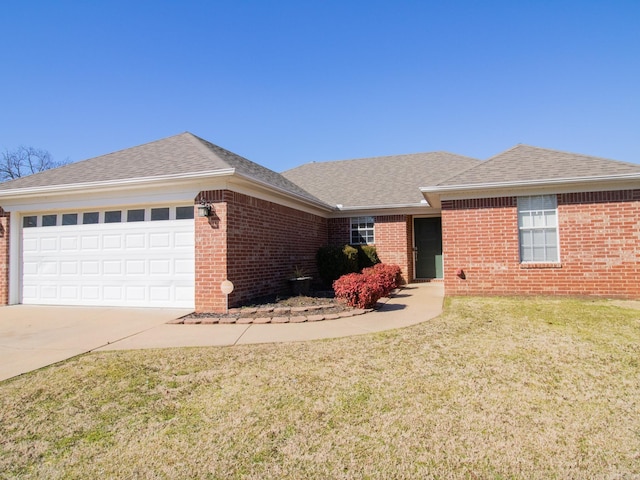 ranch-style home with a garage, driveway, roof with shingles, and brick siding