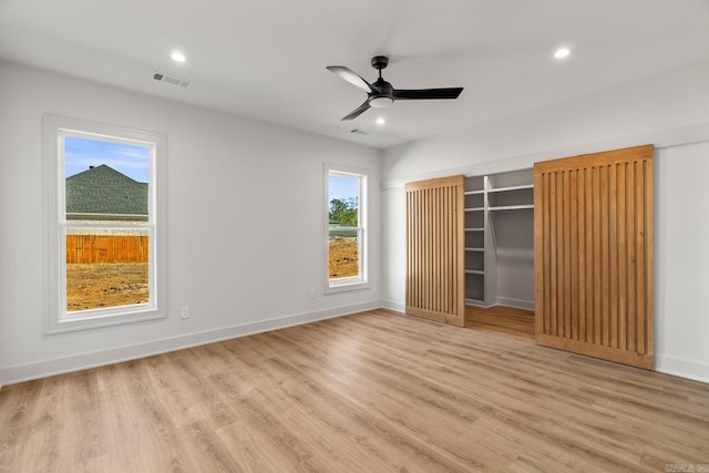 unfurnished bedroom featuring light wood finished floors, baseboards, visible vents, ceiling fan, and recessed lighting