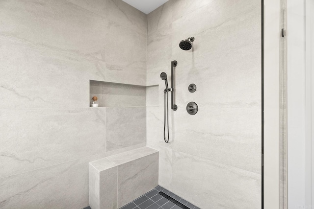 bathroom with tiled shower