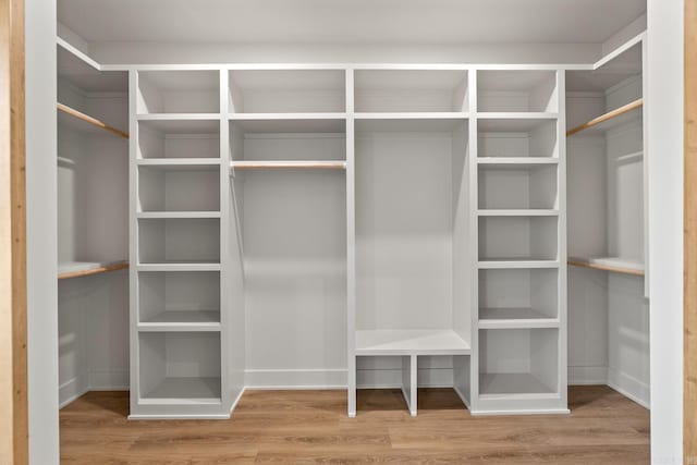 spacious closet with wood finished floors