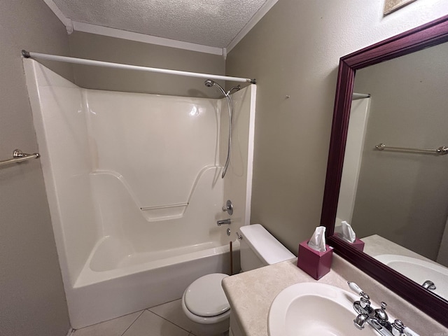 full bathroom featuring a textured ceiling, tile patterned flooring, toilet, vanity, and shower / washtub combination