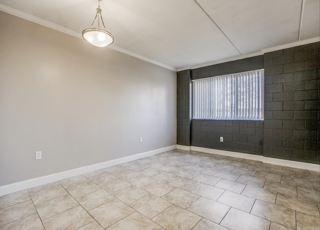 empty room with baseboards and crown molding