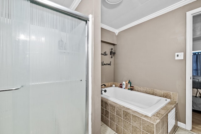 bathroom with a stall shower, crown molding, a bath, and ensuite bathroom