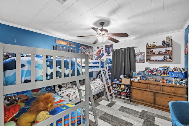 bedroom featuring ceiling fan, carpet floors, and ornamental molding