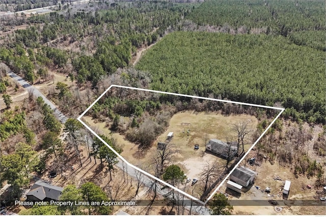 bird's eye view featuring a forest view