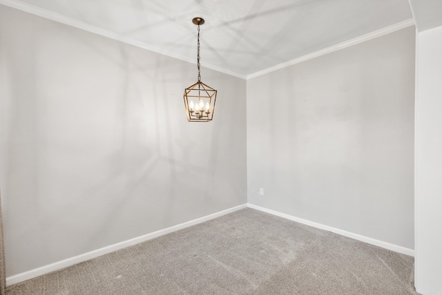 carpeted empty room featuring an inviting chandelier, baseboards, and crown molding