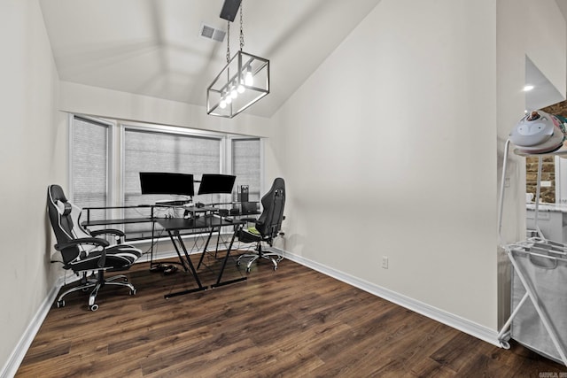 office space with lofted ceiling, wood finished floors, visible vents, and baseboards