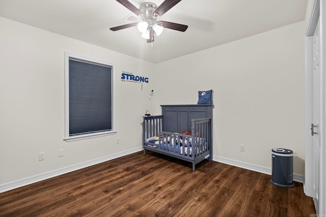 bedroom with ceiling fan, baseboards, and wood finished floors