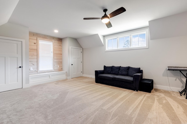 living area with carpet floors, recessed lighting, a ceiling fan, vaulted ceiling, and baseboards