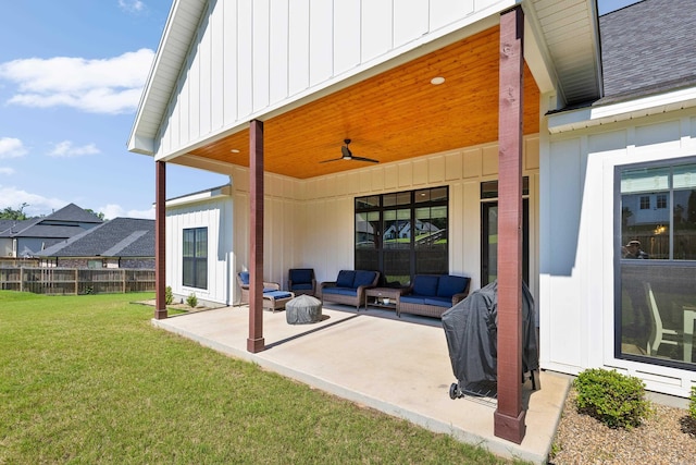 view of patio featuring a ceiling fan, outdoor lounge area, and fence