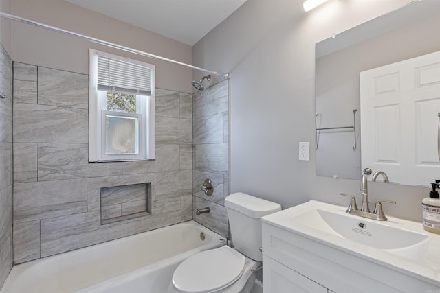 bathroom with shower / bathing tub combination, vanity, and toilet