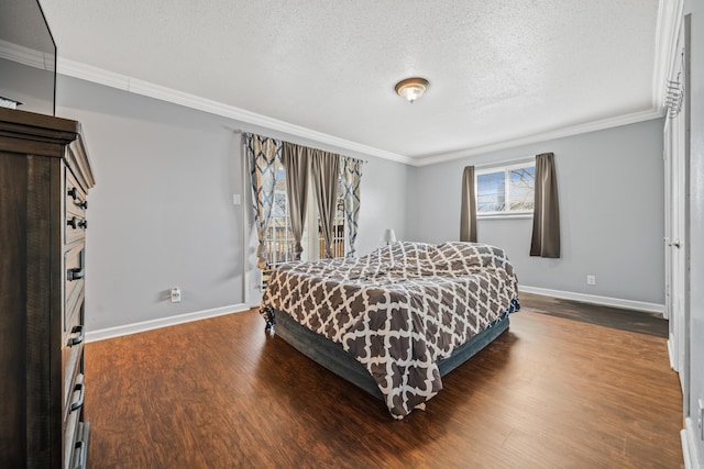 bedroom featuring dark wood-style floors, crown molding, and baseboards