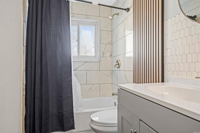 full bath with shower / bath combo, vanity, and toilet