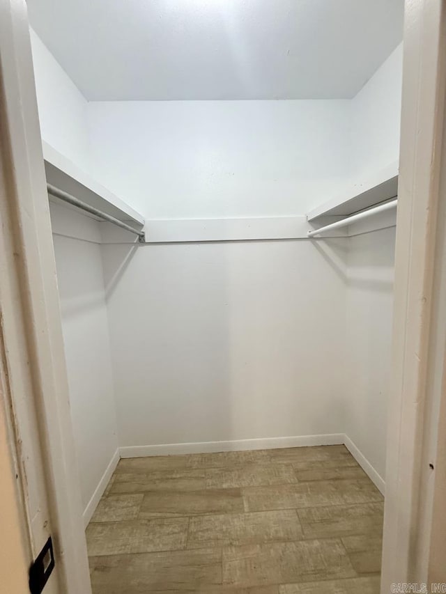 spacious closet with light wood-style floors