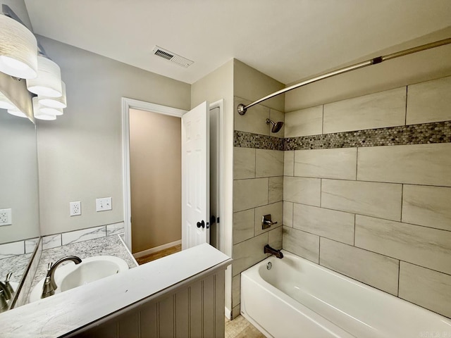 full bath with  shower combination, visible vents, and vanity