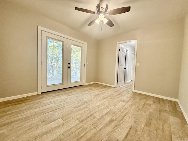 unfurnished room featuring ceiling fan, french doors, light wood-type flooring, and baseboards