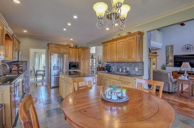 dining space with a chandelier, recessed lighting, and crown molding