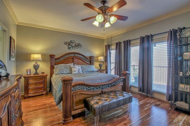 bedroom with ceiling fan, baseboards, wood finished floors, and crown molding