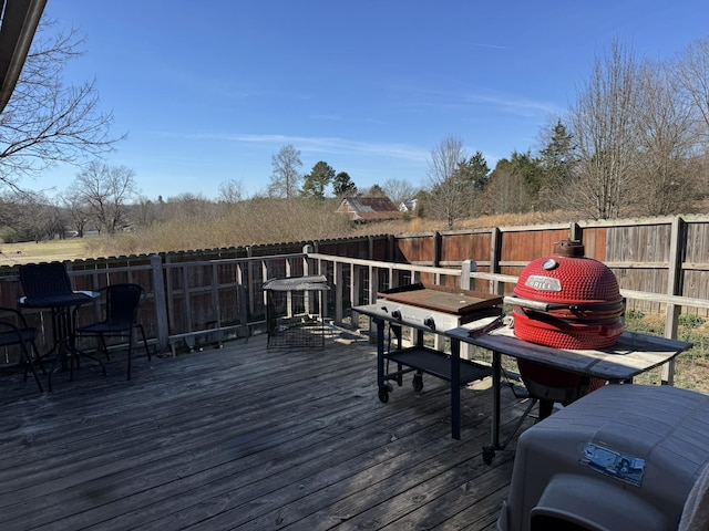 deck with a fenced backyard