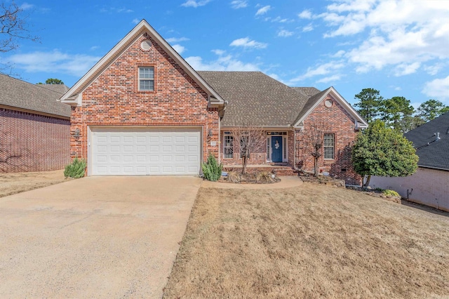 traditional-style home featuring concrete driveway, brick siding, a front lawn, and a shingled roof