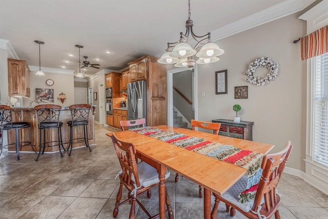 dining room with stairs, ornamental molding, and a wealth of natural light