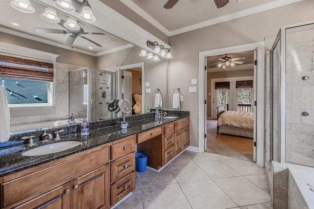 ensuite bathroom featuring ensuite bath, ornamental molding, and a sink