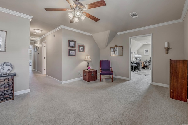 sitting room with baseboards, visible vents, ceiling fan, ornamental molding, and carpet