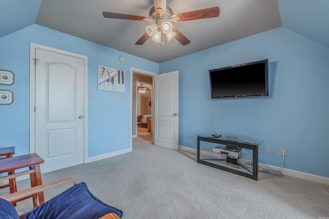 interior space featuring ceiling fan, baseboards, and vaulted ceiling