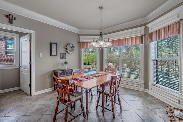 dining area featuring a notable chandelier, baseboards, tile patterned floors, and crown molding