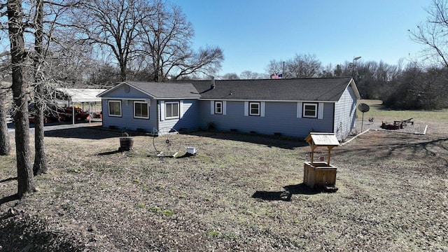 rear view of property with crawl space