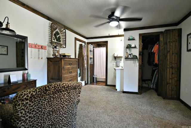 bedroom with ornamental molding, carpet flooring, a ceiling fan, and baseboards