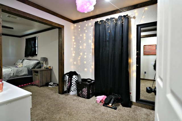 carpeted bedroom featuring visible vents