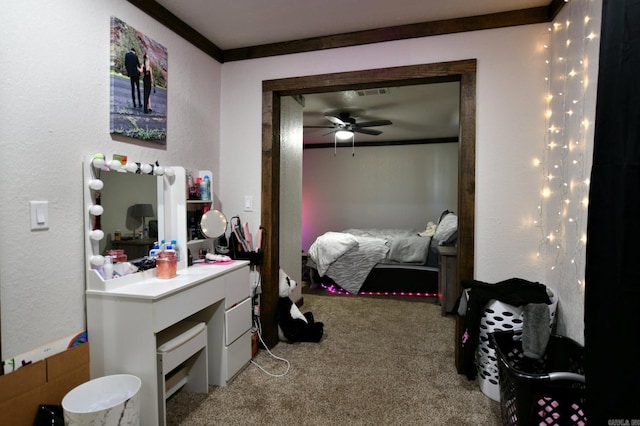 bedroom with a textured wall, light colored carpet, and crown molding